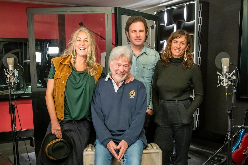 John Schumann with The Waifs band members Donna Simpson, Josh Cunningham and Vikki Thom stand together at the recording studio.
