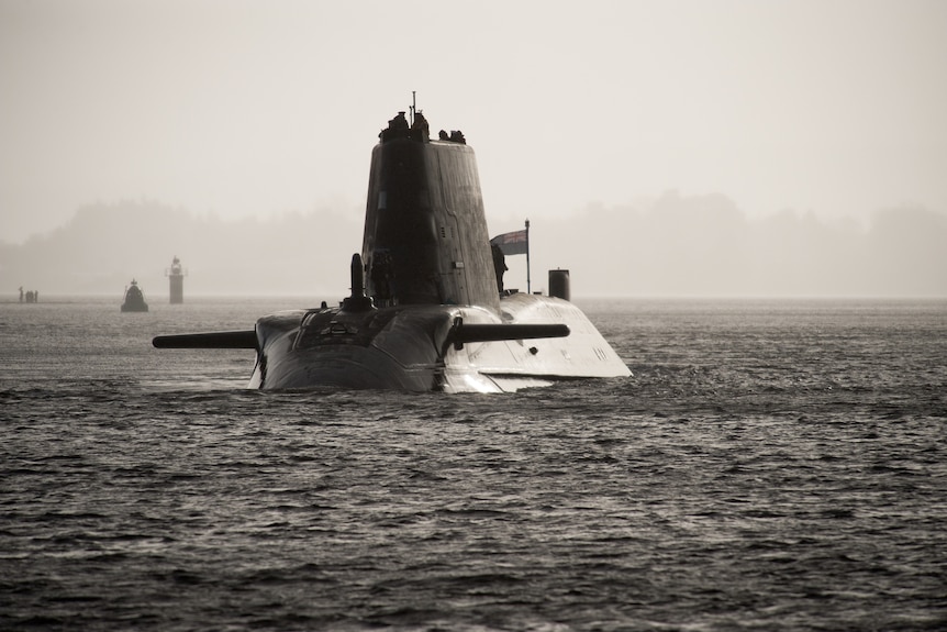 A submarine moves through calm waters