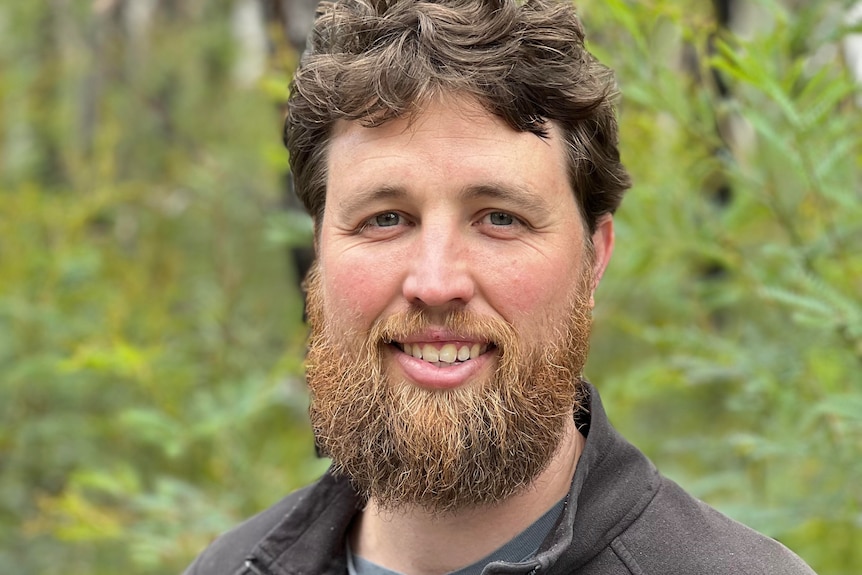 A close up shot of a bearded man 