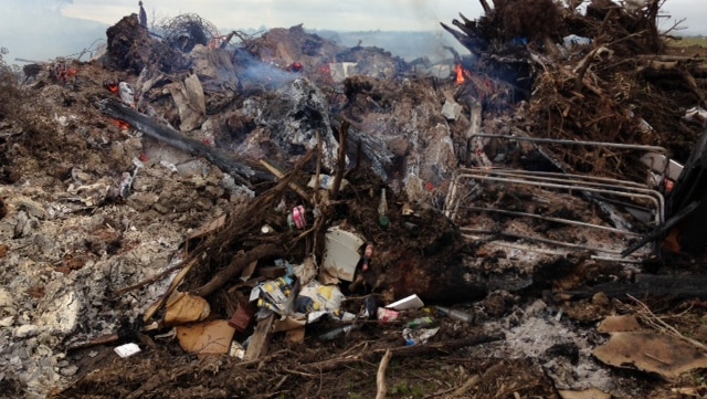 The Environment Protection Authority investigates material burnt off behind the Ballarat Airport on August 29, 2014.