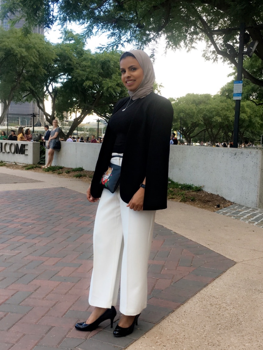 Fatimah Almathami stands in a park.