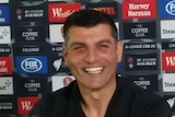 All smiles ... John Aloisi speaks to the media about his appointment as Brisbane Roar coach