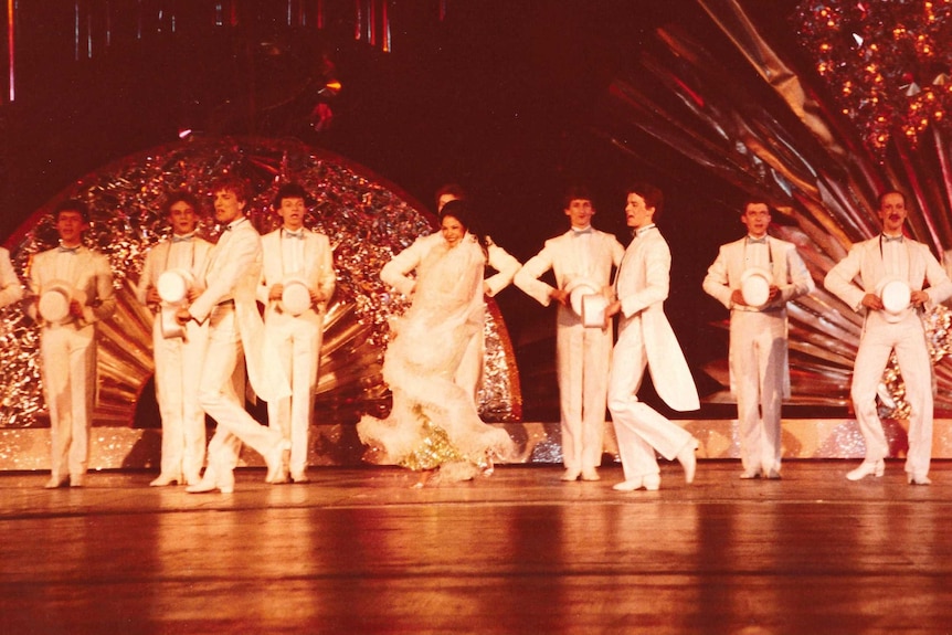 Wilma Reading performing. with male back-up dancers