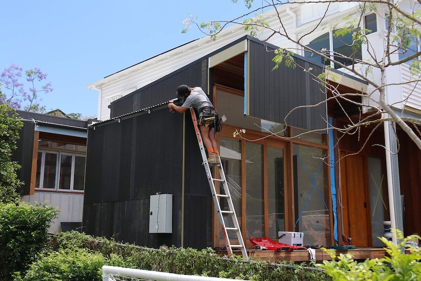 Construction worker working on a site of a house renovation in Brisbane on October 31, 2018