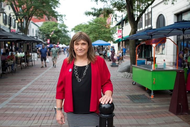 Christine Hallquist stands smiling in a street in Vermont