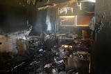 The charred remains of a badly burnt room destroyed by fire
