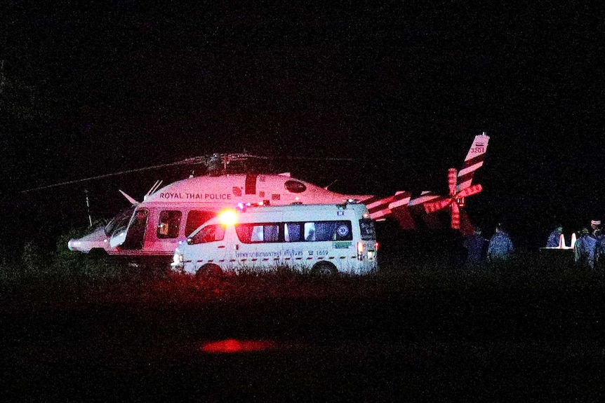 A Royal Thai Police helicopter carrying rescued schoolboys lands at a military airport