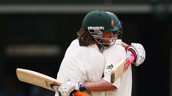 Andrew Symonds congratulates Mike Hussey
