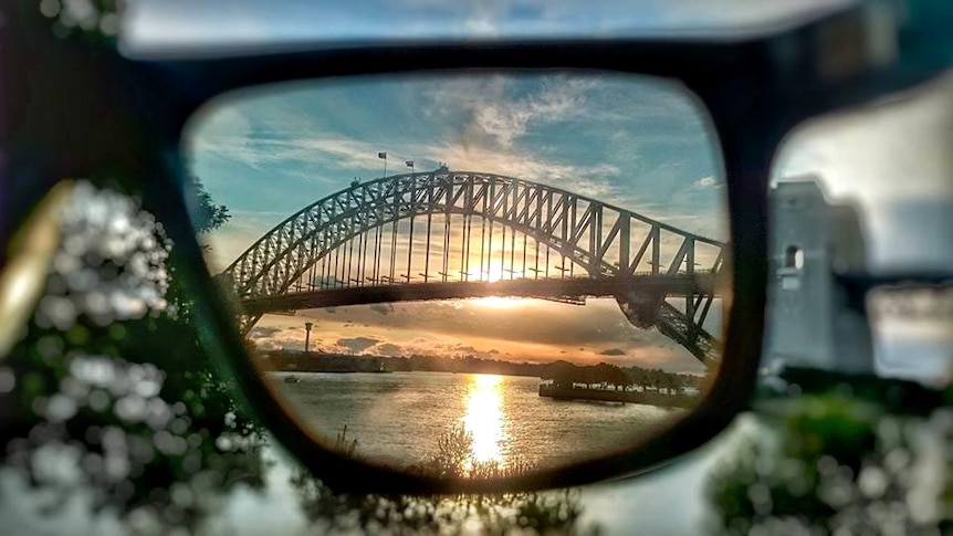 The Sydney Harbour Bridge seen through a pair of sunglasses.