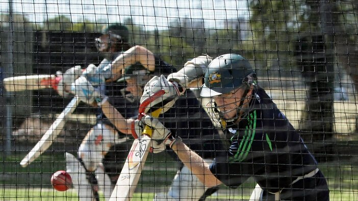 Chris Rogers plays a shot in the nets