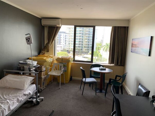 A makeshift health clinic in a hotel room.