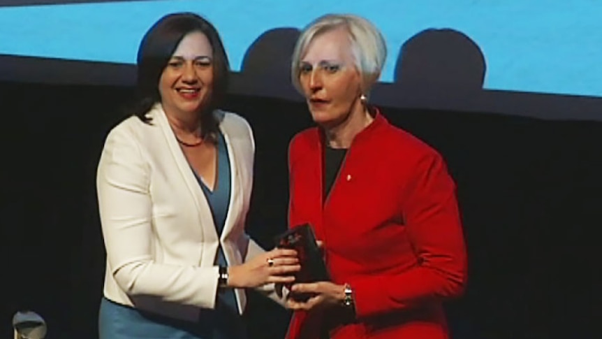 Premier Annastacia Palaszczuk handing Catherine McGregor her Queensland Australian of the year award