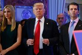 Donald Trump stands next to Allen Weisselberg, Ivanka Trump and Donald Trump Jr.