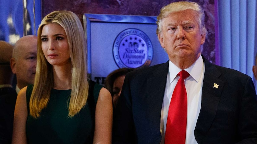 Donald Trump stands next to his daughter Ivanka Trump