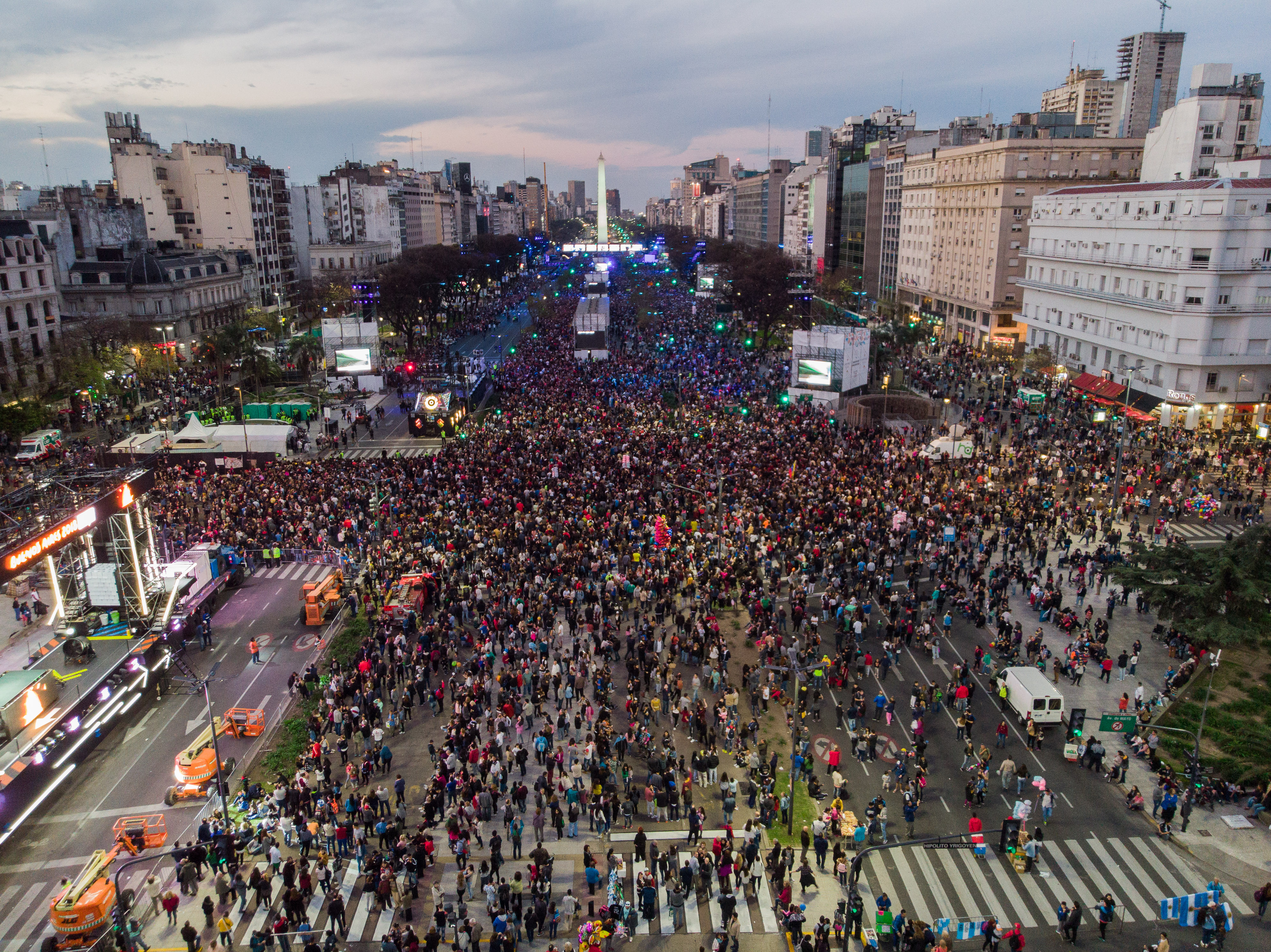 A large outdoor parade with lots of people taking part