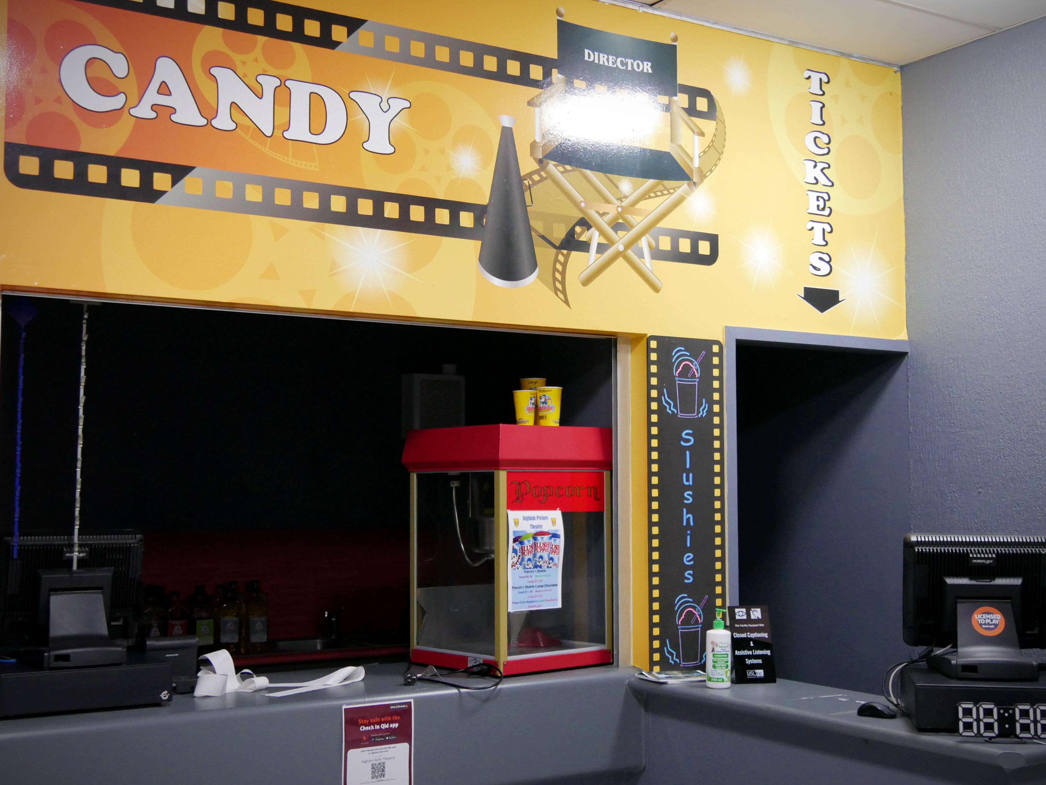 An empty candy bar and ticket desk in a cinema.