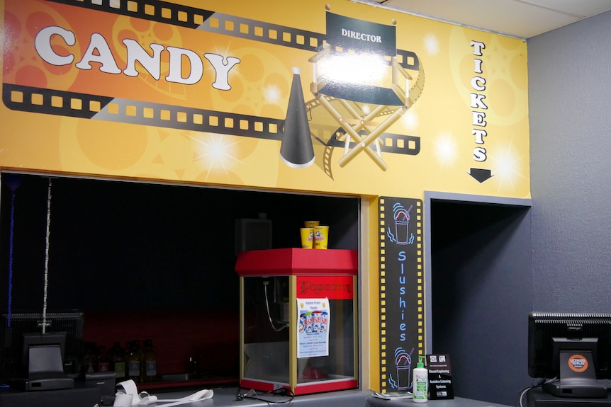 An empty candy bar and ticket desk in a cinema.