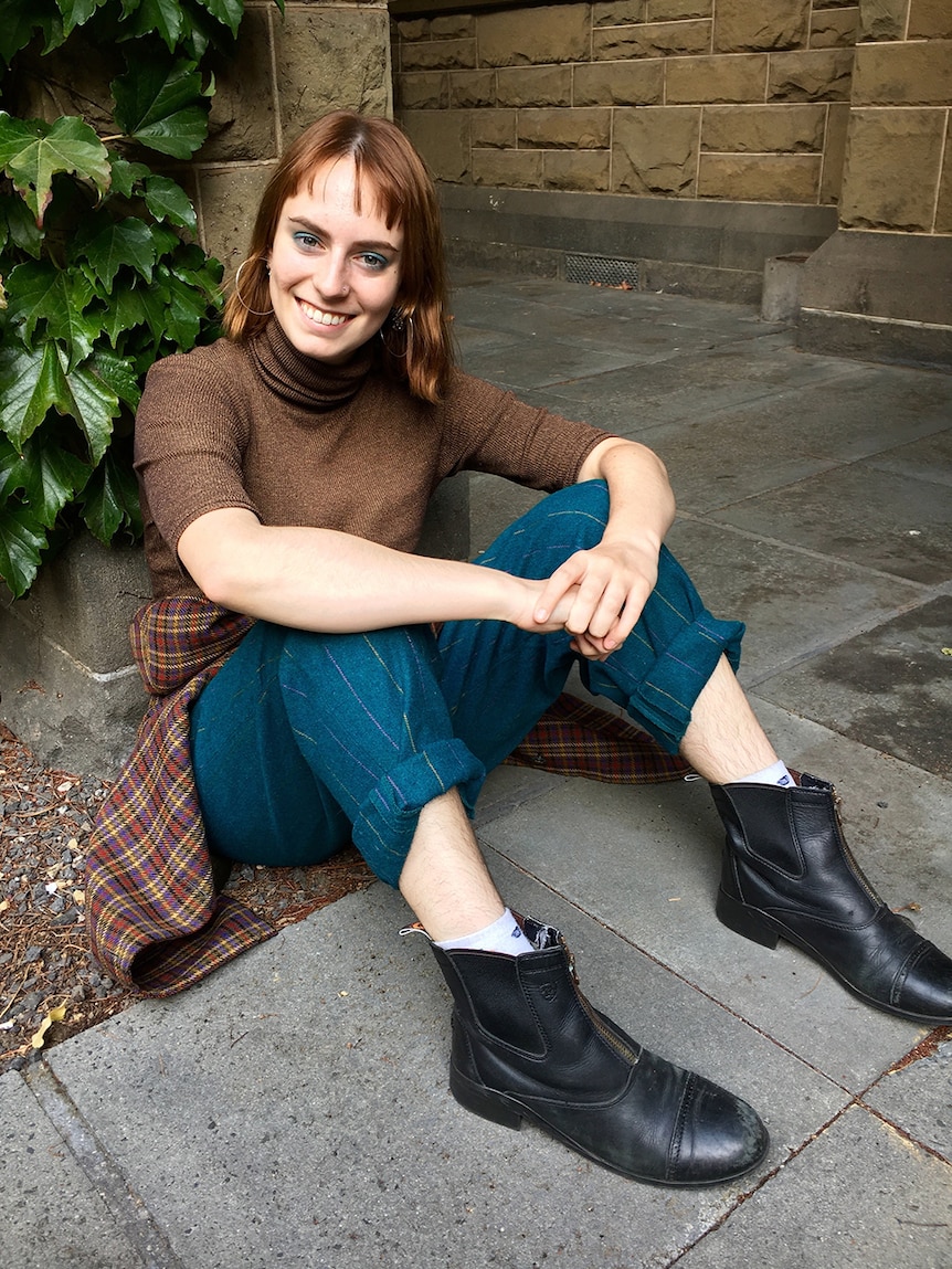 A woman smiles at the camera.