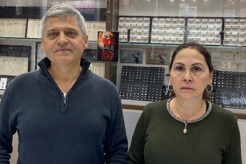 Charles and Fadia Nasr stand in the jewellery shop their own and operate.