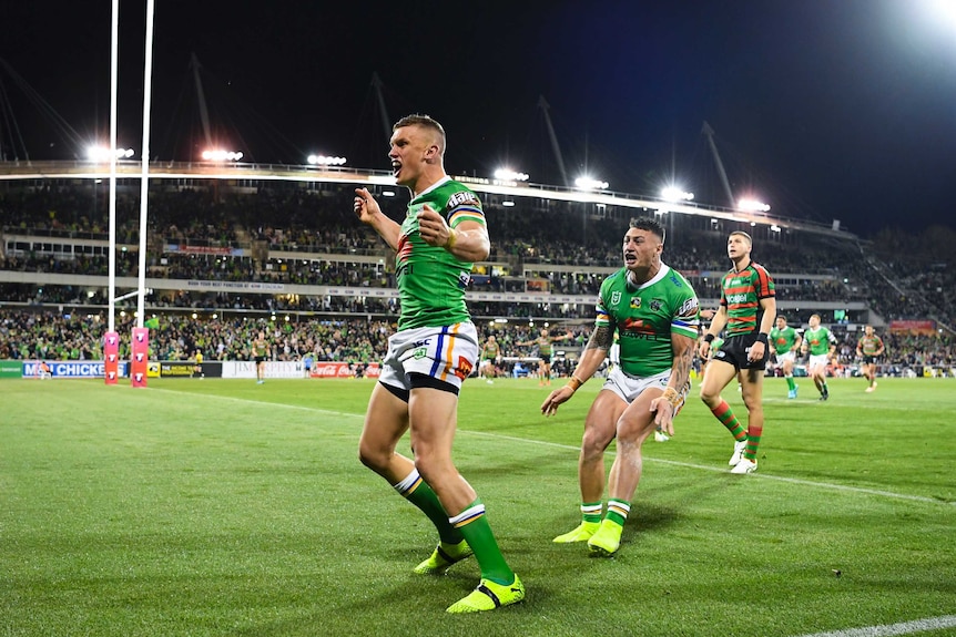 Wighton cheers, a huge stadium of people behind him.