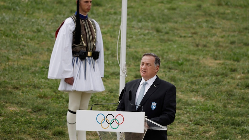 Man giving speech at podium. 