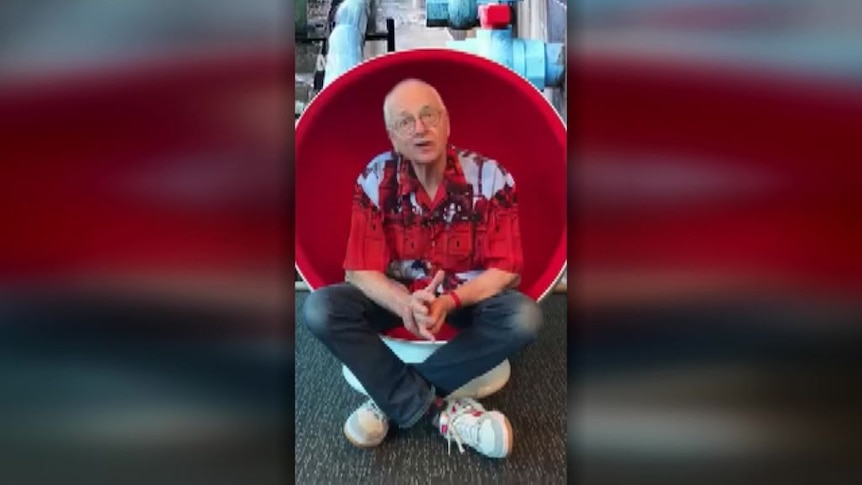Screengrab of an AI-generated social media ad of Dr Karl sitting in an egg chair.