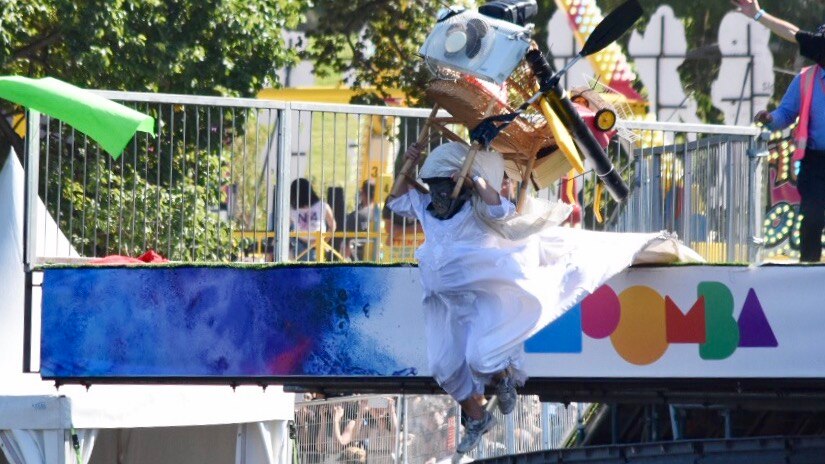 A Moomba birdman competitor appears to using an assortment of hard rubbish to take flight.