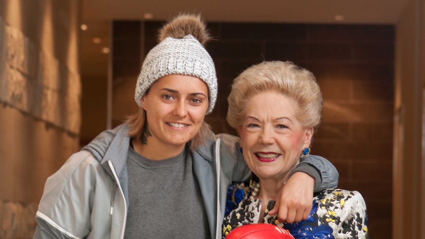 Moana Hope, Susan Alberti and the footy with which Moana kicked her 100th goal.