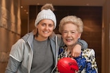 Moana Hope, Susan Alberti and the footy with which Moana kicked her 100th goal.