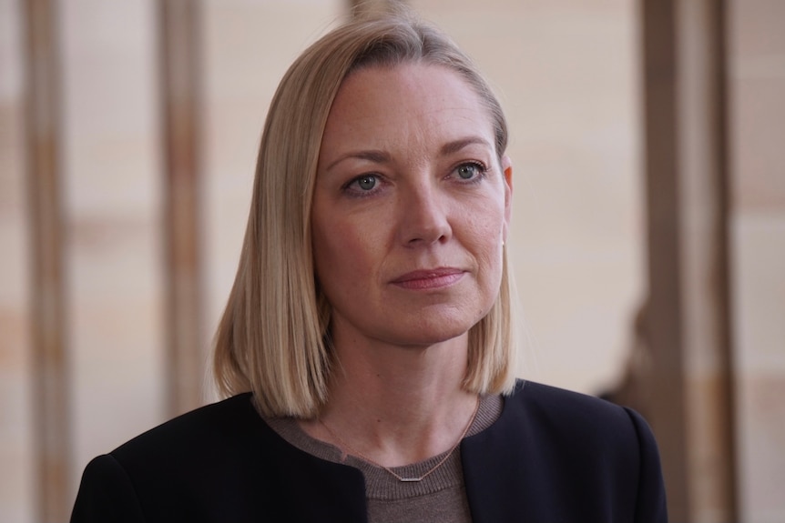 Head and shoulder shot of Mia Davies standing outside WA Parliament. 