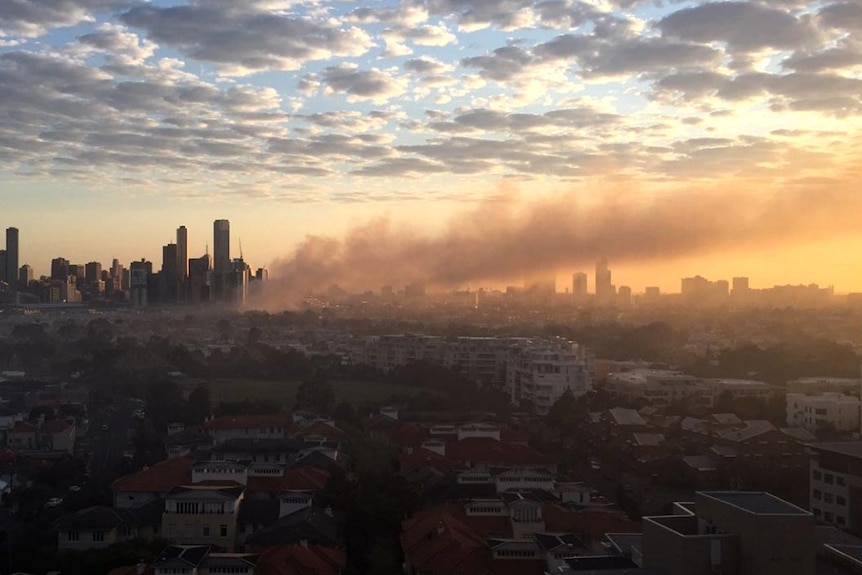 Smoke from a fire at the Albion bar in South Melbourne moves across the city.