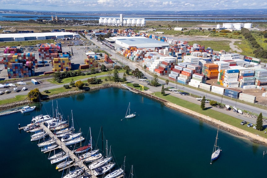 A drone shot of the marina, and the surrounding shipping container yard.