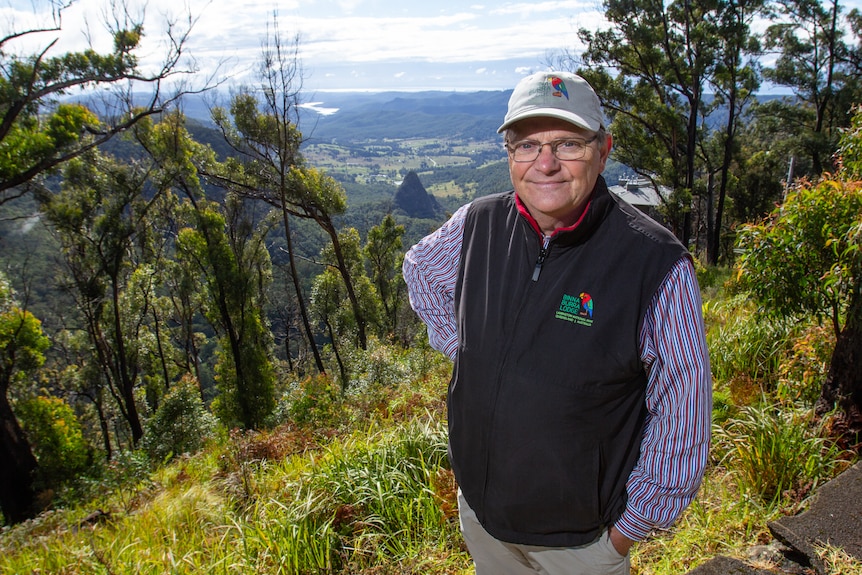Man standing in front of Scenic Rim landscape.