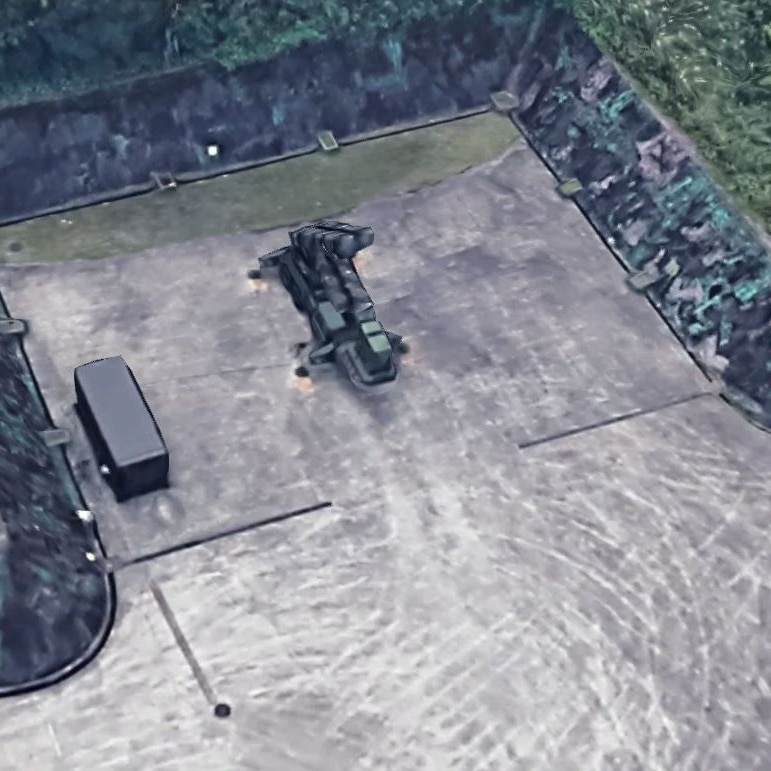 A Google satellite image shows a concrete bunker with a truck with missiles loaded on the back of it.