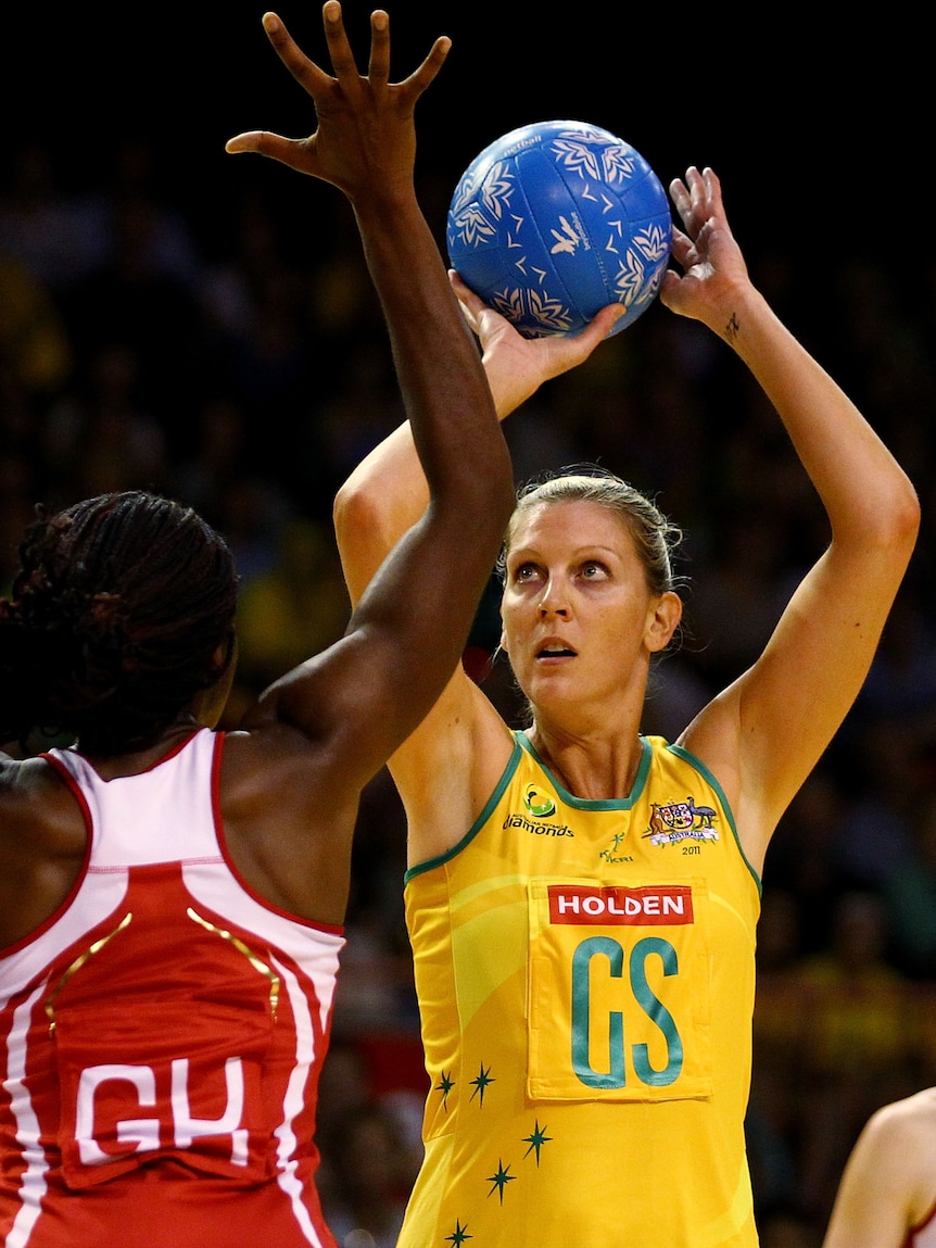 Milestone ... stand-in skipper Catherine Cox shoots on her way to 2,000 Test goals.