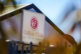 The exterior sign of the Gillen Club, with a slogan reading 'your club, your community'