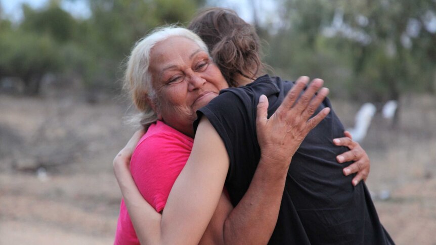 Ngemba Elder Aunty Doreen hugging Alexandra Agoston, daughter of filmmaker Susie Agoston.