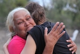 Ngemba Elder Aunty Doreen hugging Alexandra Agoston, daughter of filmmaker Susie Agoston.