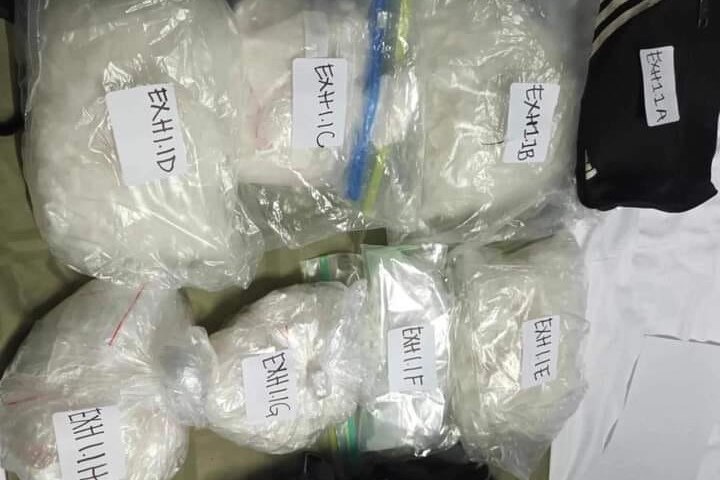 Bags of white powder marked as exhibits.