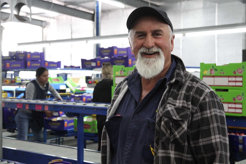 Stonefruit grower Dino Cerrachi smiles at the camera.