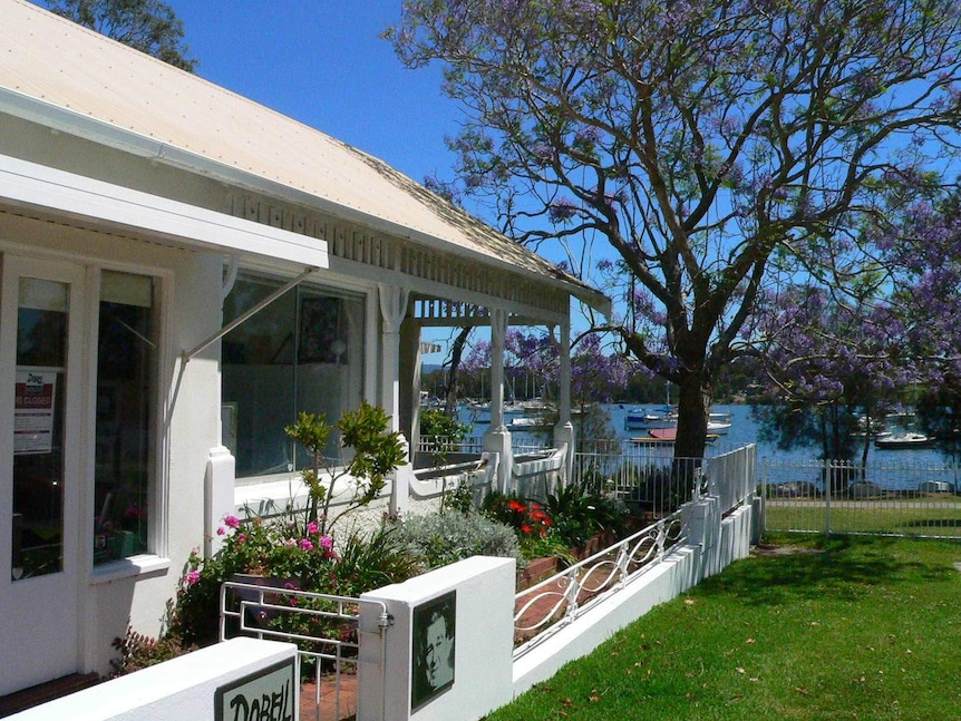 The verandah of Dobell House, with Lake Macquarie in the background.