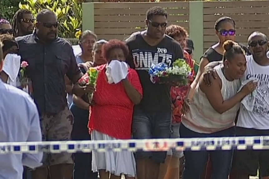 Families of children who died in Cairns grieve behind police barrier
