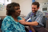 Dr Simon Quilty treats an Indigenous patient in Katherine, NT.