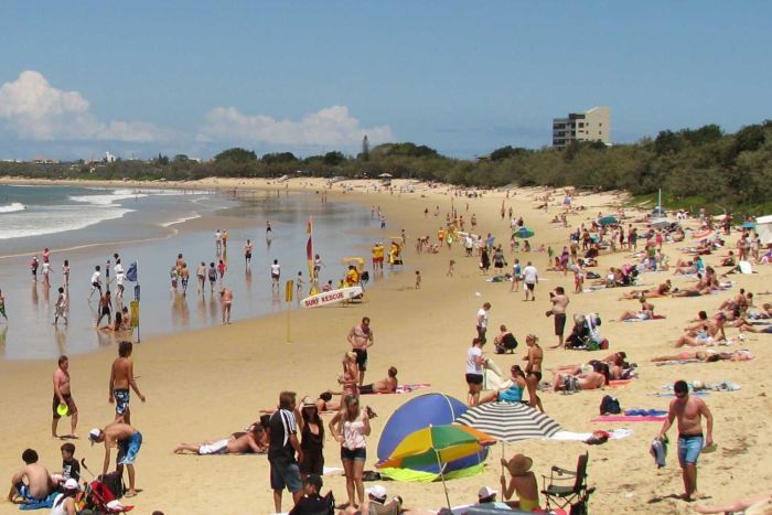 A crowded beach on a sunny day.