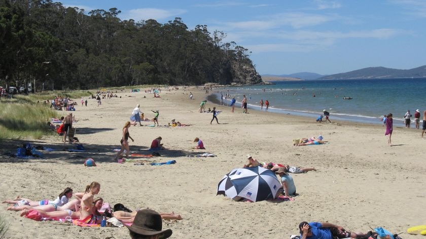 people at the beach in tasmania