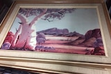 A framed watercolour painting of Mt Sonder in central Australia