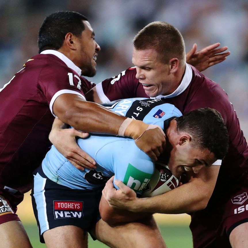 Nathan Cleary of the Blues is tackled by the Maroons defence during Game 2 of the 2020 State of Origin series between the NSW Blues and QLD Maroons at ANZ Stadium in Sydney, Wednesday, November 11, 2020