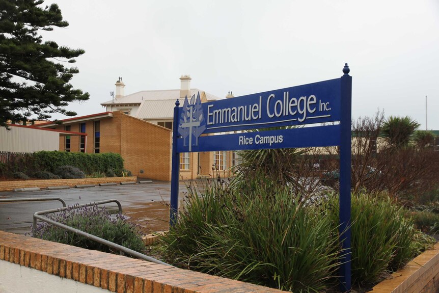 A sign that says "Emmanuel College" outside a school building.