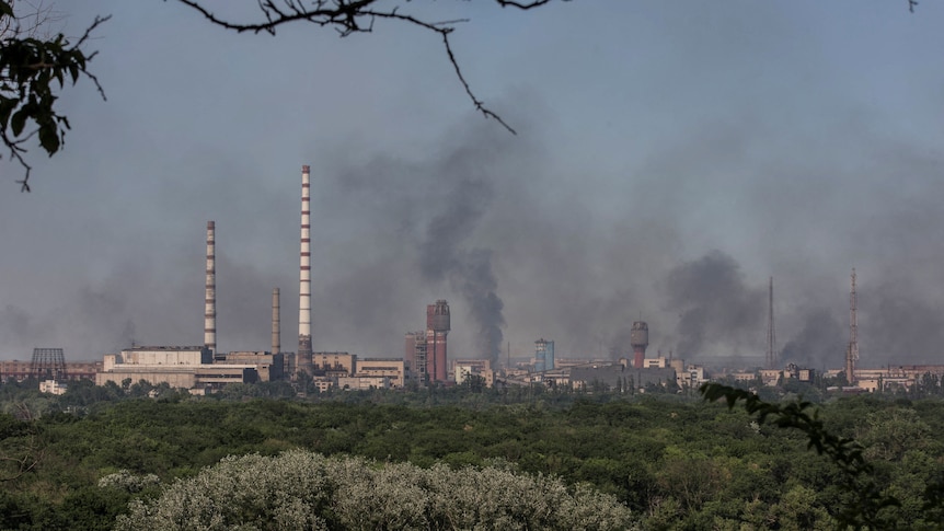 Smoke rises after a military strike near the Azot plant