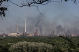Smoke rises after a military strike near the Azot plant